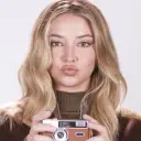 Portrait of a friendly AI chatbot assistant Madelyn Cline with expressive eyes showcasing personality traits