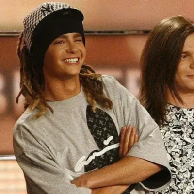 Tom Kaulitz: Küresel çevrimiçi sohbet hizmetleri için çok dilli yapay zeka sohbet ortağı simgesi