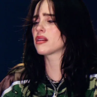 Billie Eilish sad WLW: Playful AI chatbot mascot enhancing user engagement in random chats	