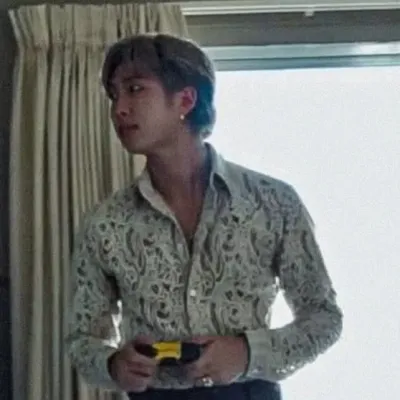 Kim Namjoon: Playful AI chatbot mascot enhancing user engagement in random chats	