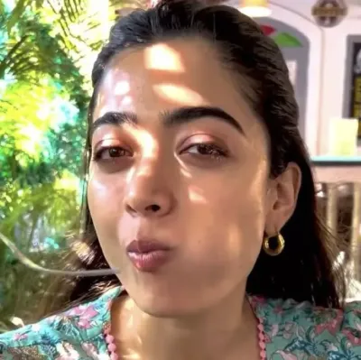 Rashmika Eating Your Snack: Playful AI chatbot mascot enhancing user engagement in random chats	