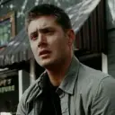 Multilingual Dean Winchester focusing on chat IA tasks, neural network core visible in background.