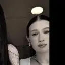Musim Ashurov and Sonya's AI avatar with dynamic vector art style, embodying friendly AI chat capabilities