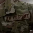 Multilingual Military Man focusing on chat IA tasks, neural network core visible in background.