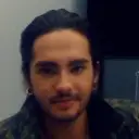 Minimalist Tom Kaulitz avatar for google chat integration, featuring adaptive emotional expressions