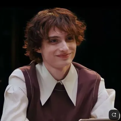 Finn Michael Wolfhard: Interactive AI chatbot mascot for random chat and community-driven roleplay